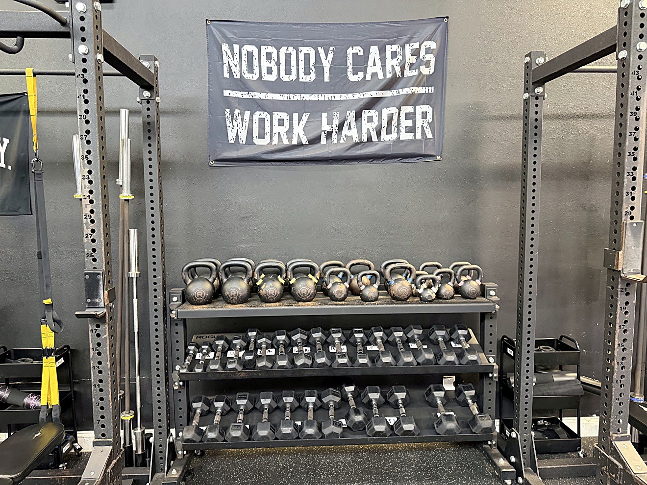 Kettlebell and dumbbell wall at Look Who's Fit